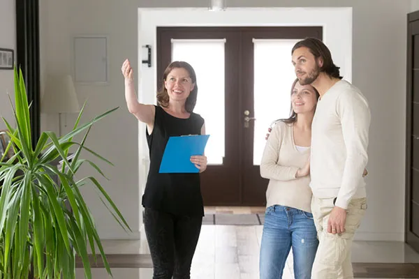 Monarch leasing advisor showing an apartment to prospective residents